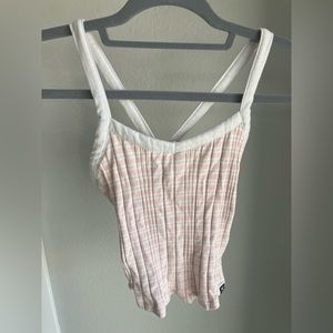 Pink and white crop top.